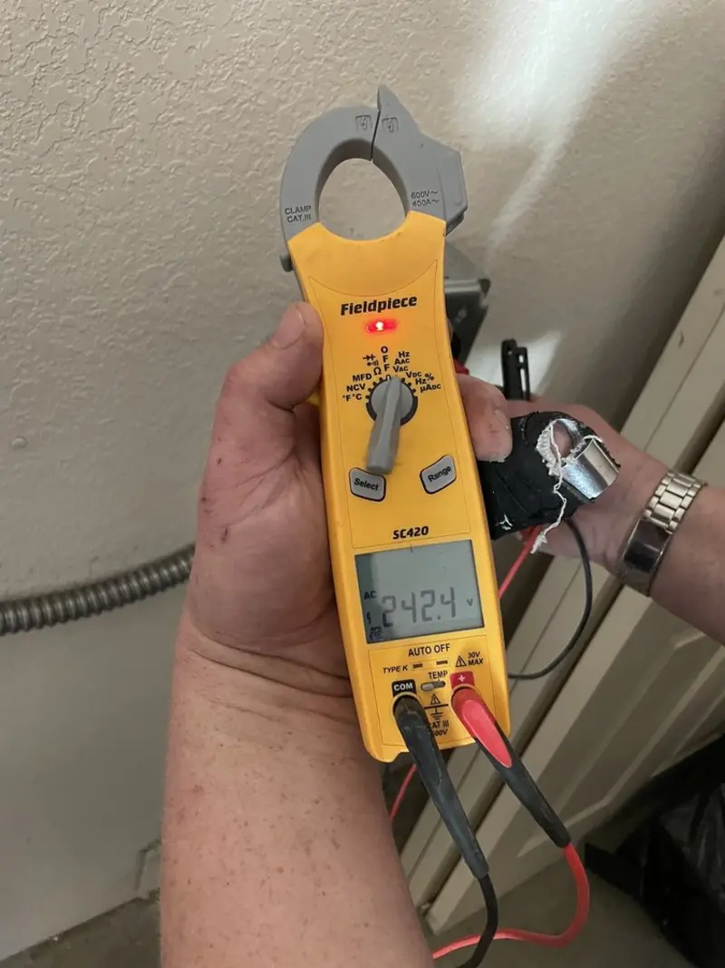 Voltage testing with clamp meter during Ceiling Fan Installation in Tehachapi